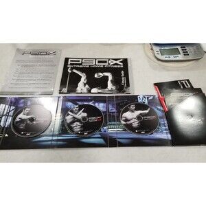 P90X plus Extreme Home Fitness workout DVD set and documents